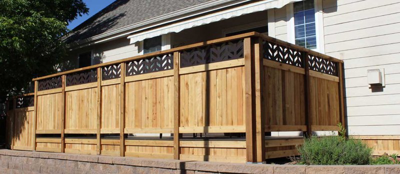 A design by an outdoor living store showcasing a completely wooden structure with chairs 